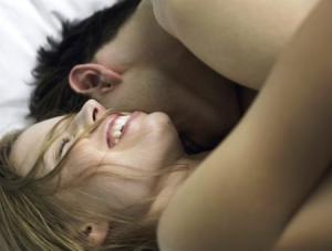 Couple in Bed --- Image by © Ole Graf/zefa/Corbis
